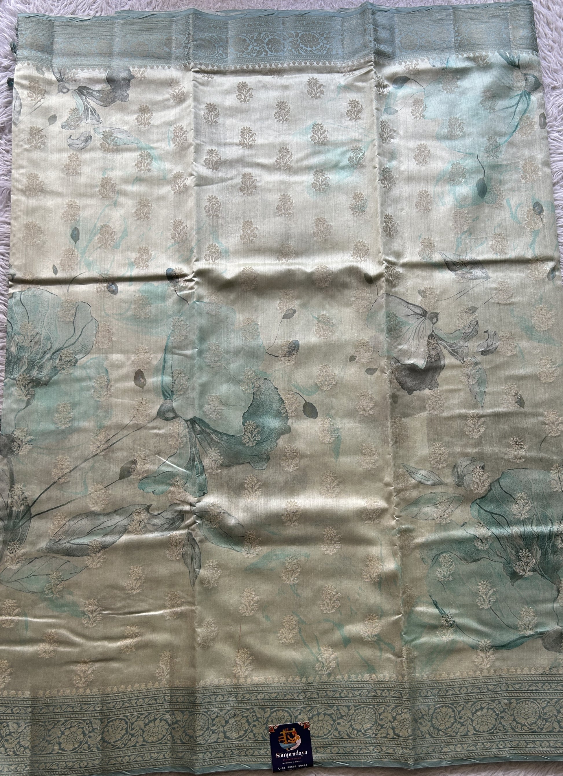 Chiniya Silk Saree Off White Colored Elegantly Paired with a Sea Blue Color Zari Border. - Sampradaya Designer Studio