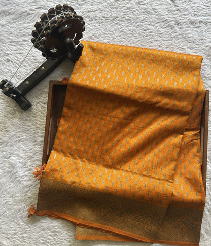 Semi Raw Silk Saree  Yellow Colored Elegantly paired with a Silver Zari Border. - Sampradaya Designer Studio