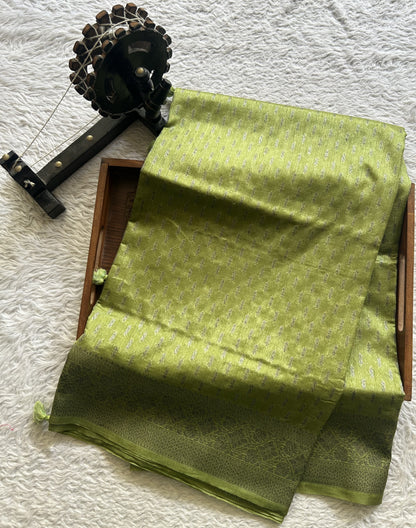 Semi Raw Silk Saree Light Green Colored Elegantly paired with a Silver Zari Border. - Sampradaya Designer Studio