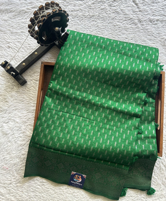 Semi Raw Silk Saree Green Colored Elegantly paired with a Silver Zari Border. - Sampradaya Designer Studio