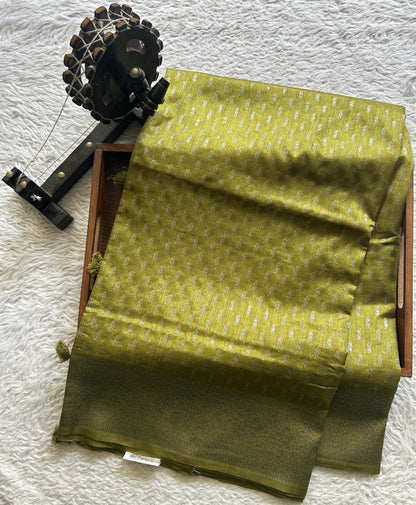 Semi Raw Silk Saree Mustard Colored Elegantly paired with a Silver Zari Border. - Sampradaya Designer Studio