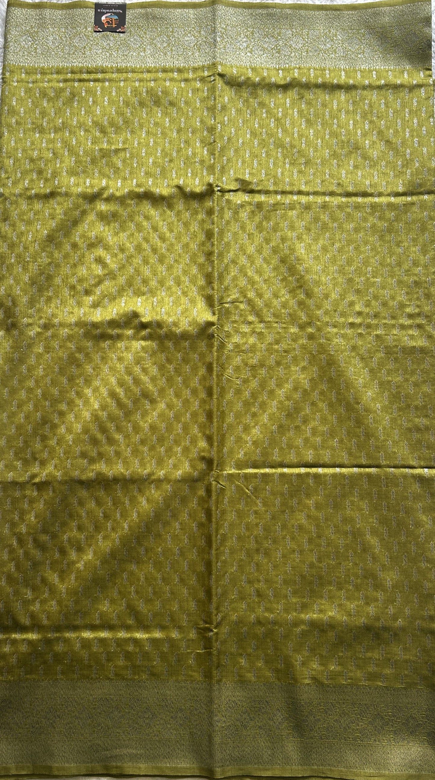 Semi Raw Silk Saree Mustard Colored Elegantly paired with a Silver Zari Border. - Sampradaya Designer Studio