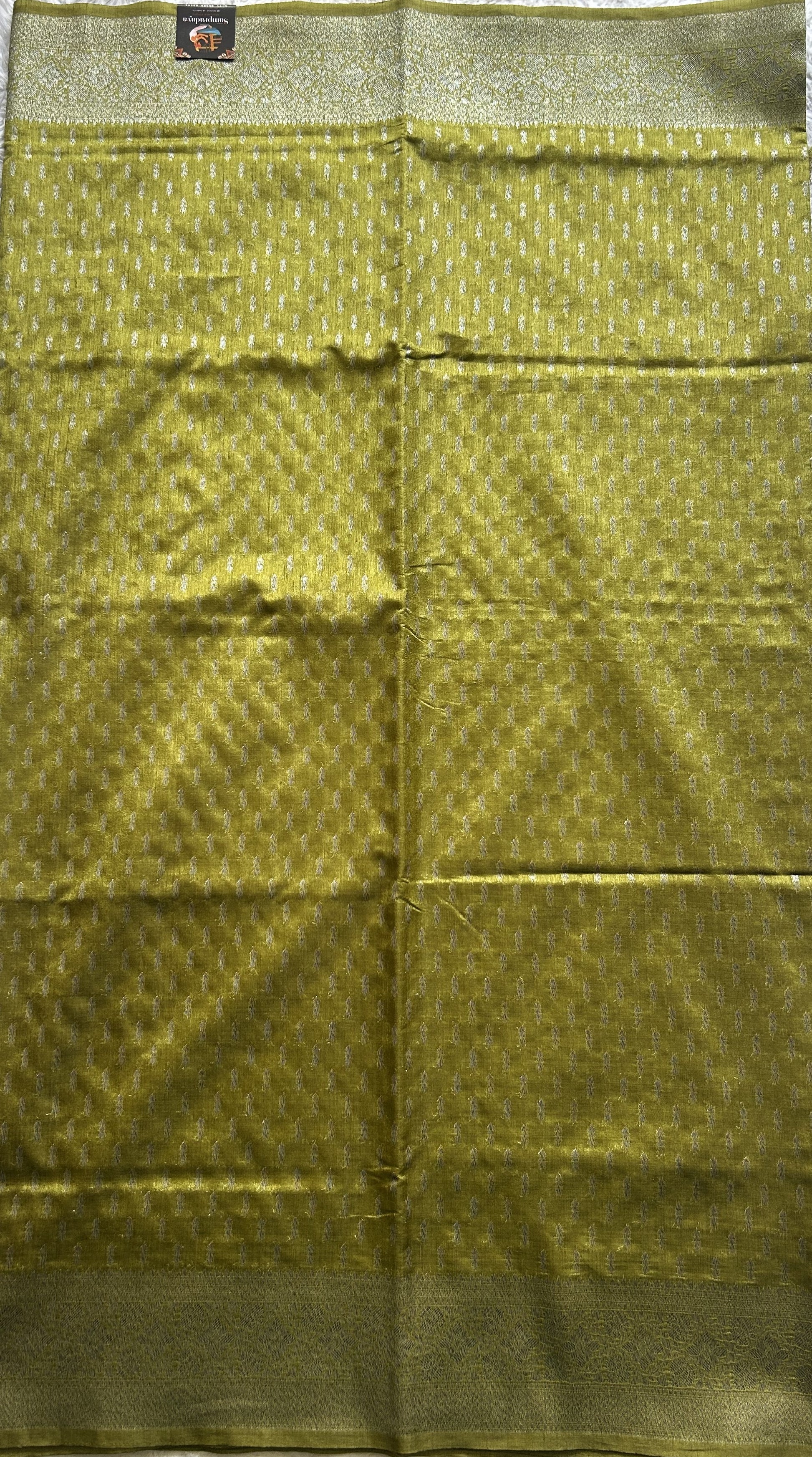 Semi Raw Silk Saree Mustard Colored Elegantly paired with a Silver Zari Border. - Sampradaya Designer Studio