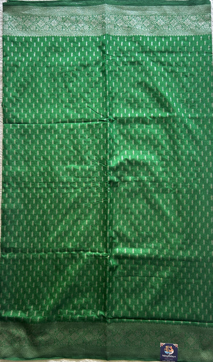 Semi Raw Silk Saree Green Colored Elegantly paired with a Silver Zari Border. - Sampradaya Designer Studio