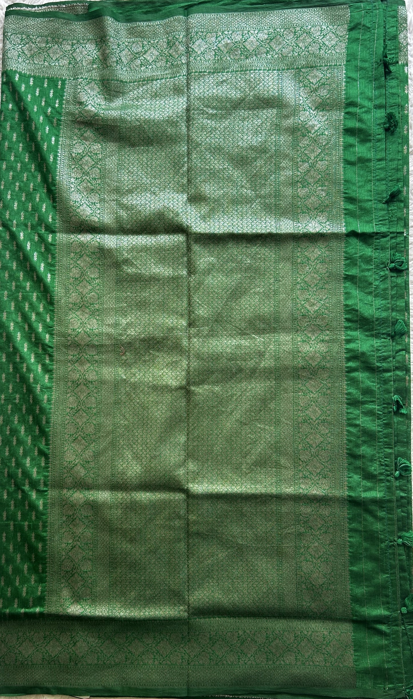 Semi Raw Silk Saree Green Colored Elegantly paired with a Silver Zari Border. - Sampradaya Designer Studio