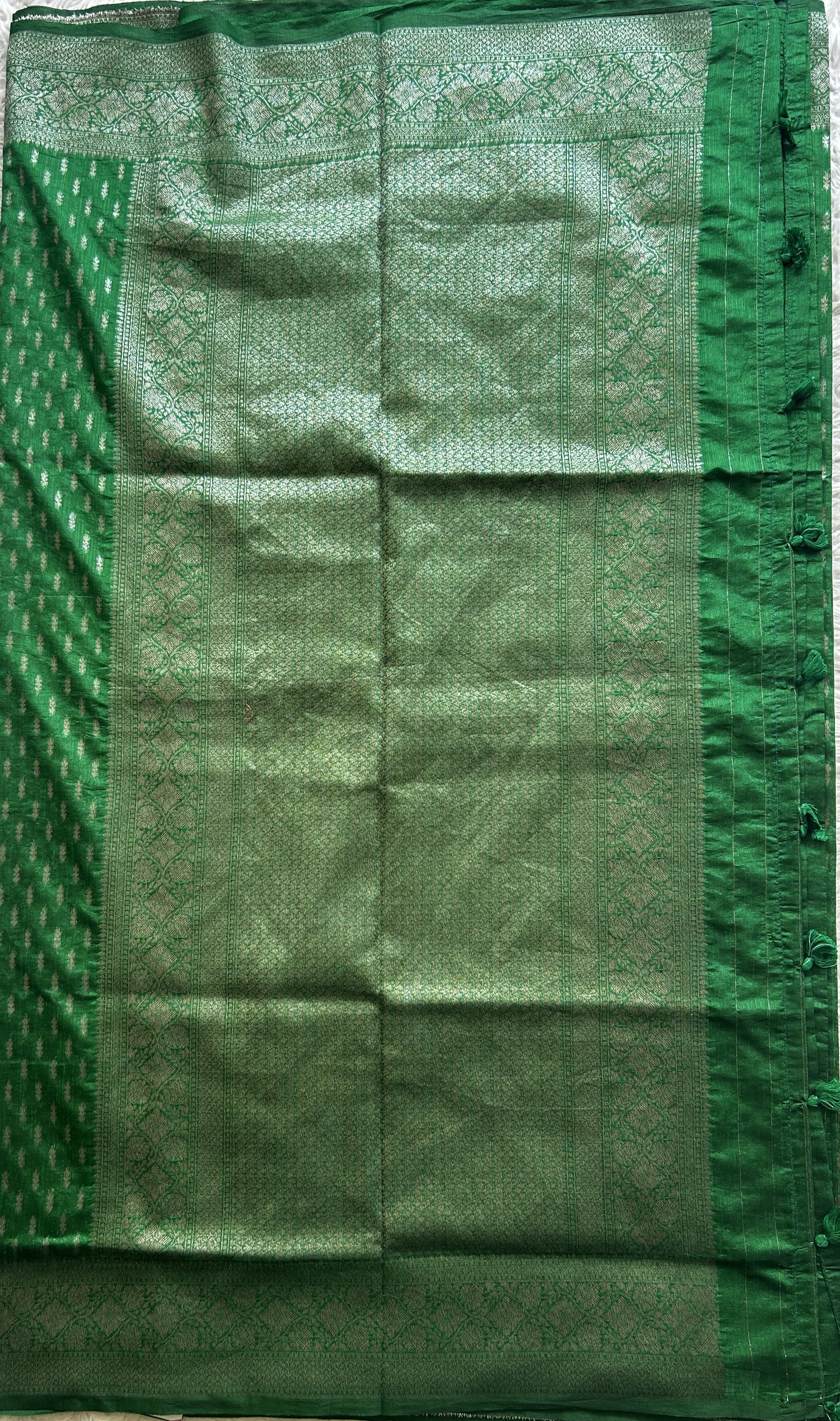 Semi Raw Silk Saree Green Colored Elegantly paired with a Silver Zari Border. - Sampradaya Designer Studio