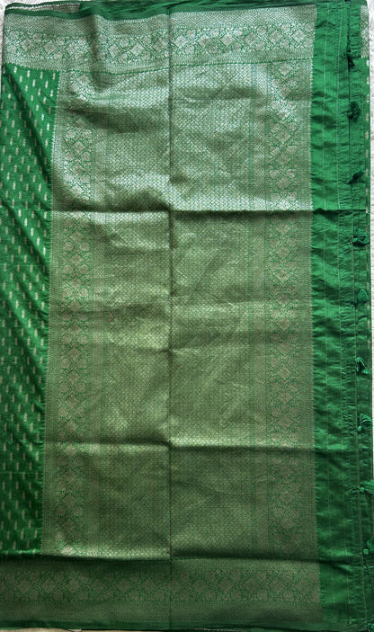Semi Raw Silk Saree Green Colored Elegantly paired with a Silver Zari Border. - Sampradaya Designer Studio