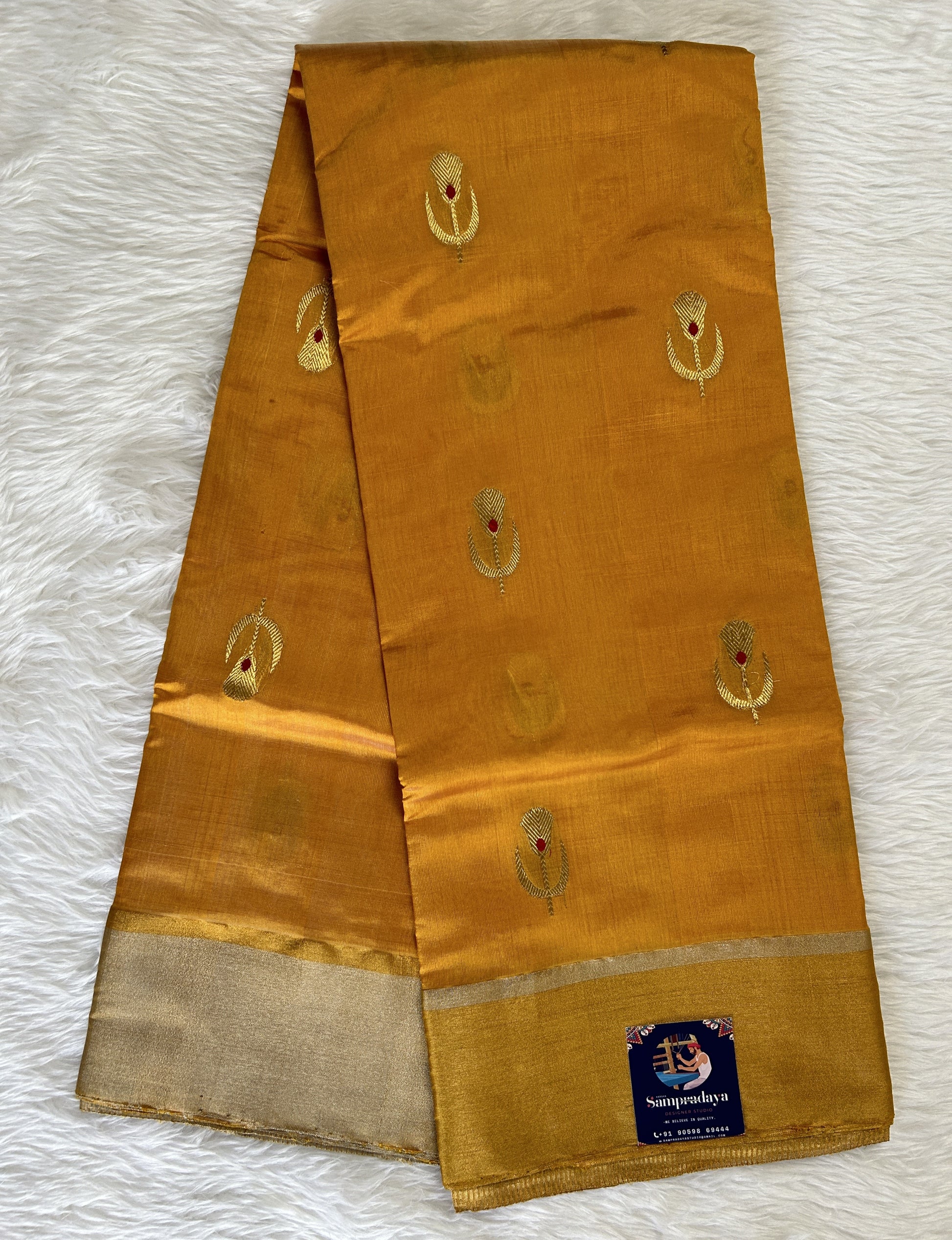 Chanderi Pattu Saree Mango Yellow colored saree complemented with a Gold Zari Weaving  Plain border - Sampradaya Designer Studio