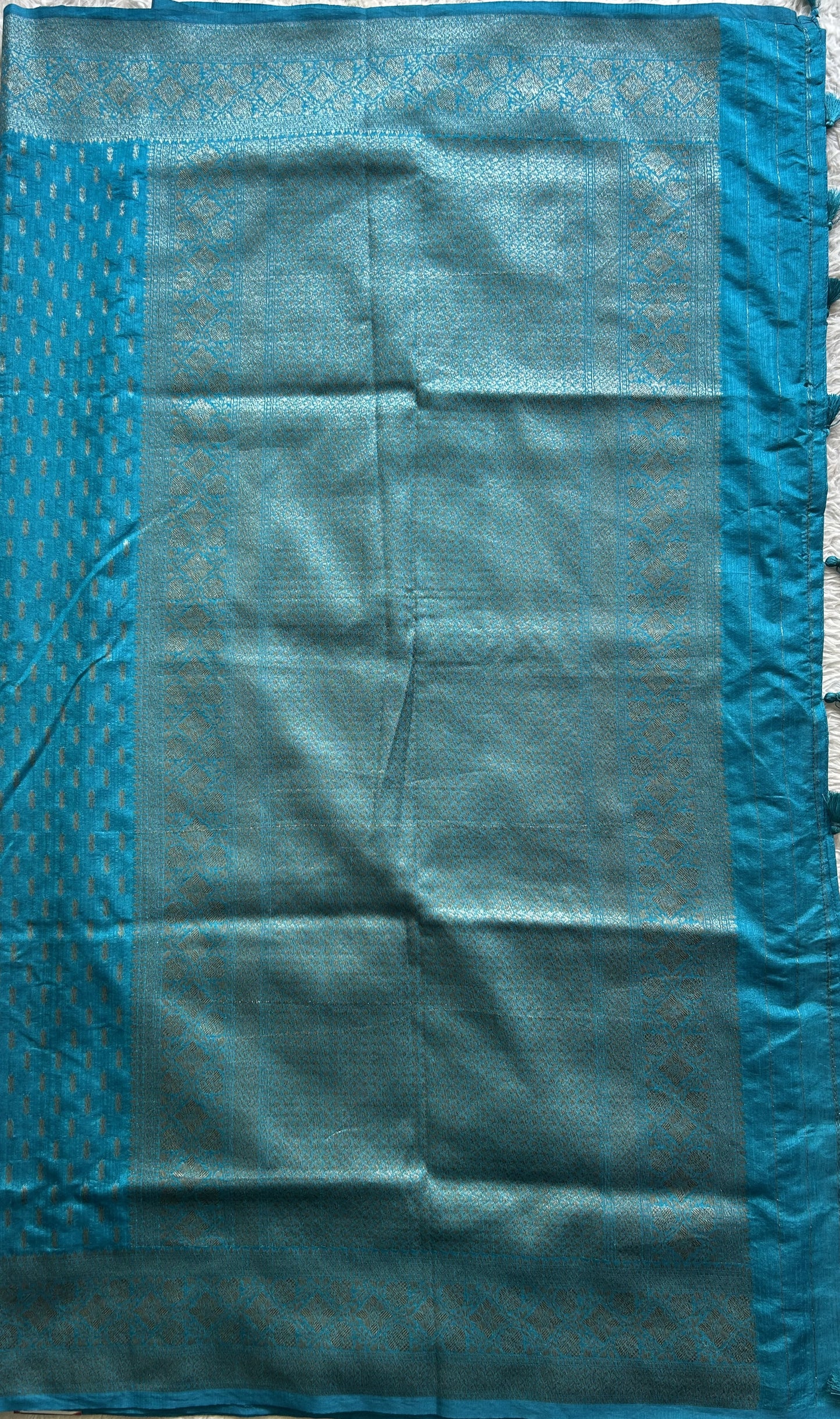 Semi Raw Silk Saree Blue Colored Elegantly paired with a Silver Zari Border. - Sampradaya Designer Studio