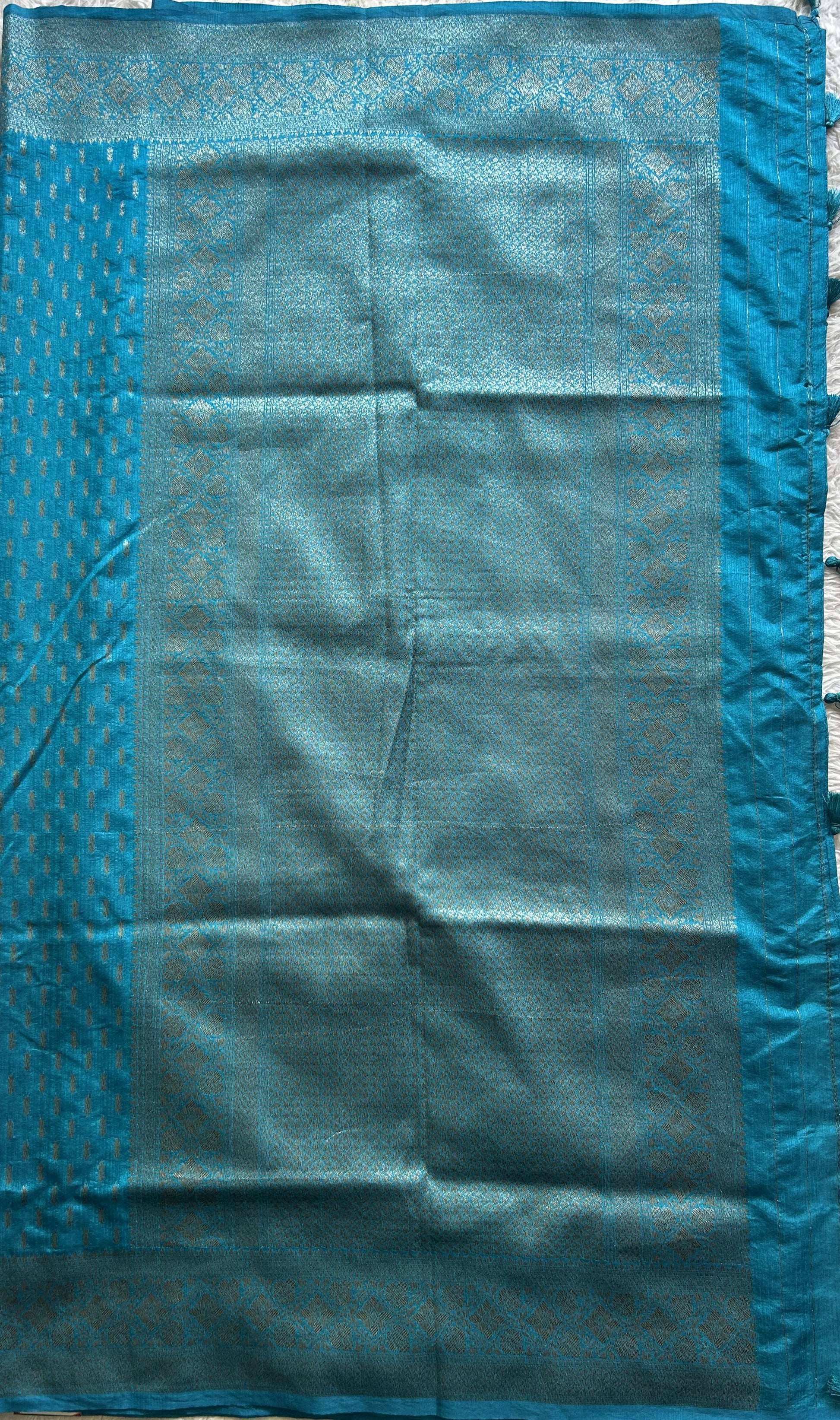 Semi Raw Silk Saree Blue Colored Elegantly paired with a Silver Zari Border. - Sampradaya Designer Studio