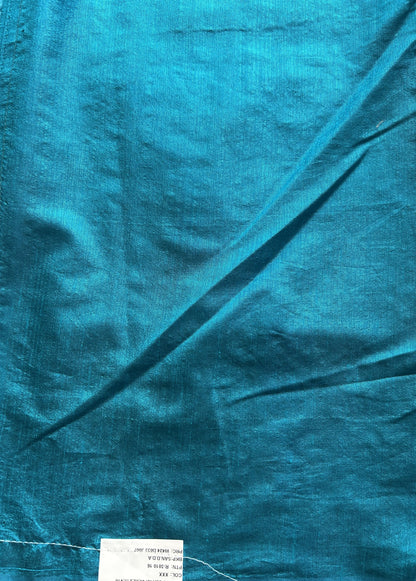 Semi Raw Silk Saree Blue Colored Elegantly paired with a Silver Zari Border. - Sampradaya Designer Studio