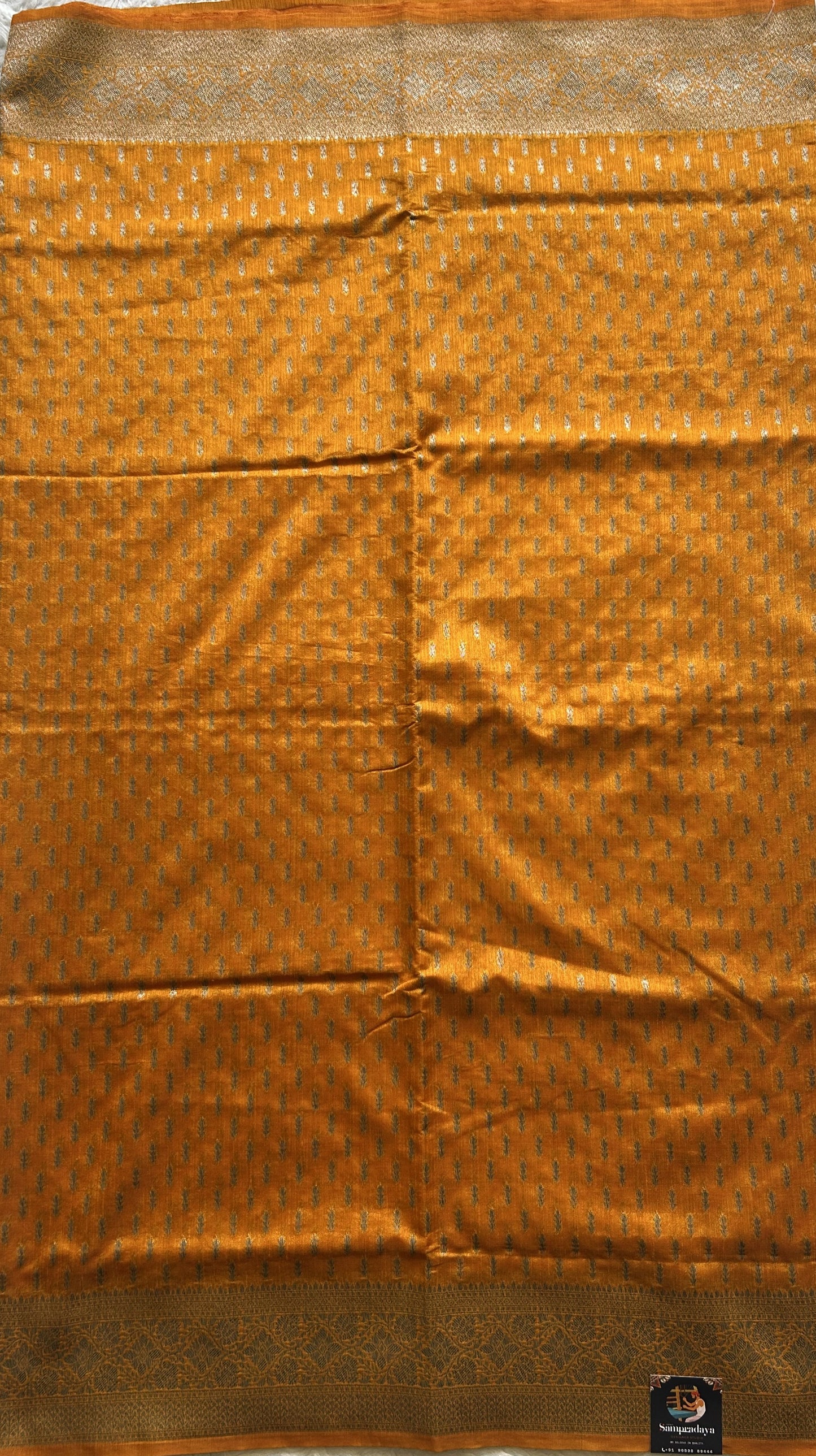 Semi Raw Silk Saree  Yellow Colored Elegantly paired with a Silver Zari Border. - Sampradaya Designer Studio