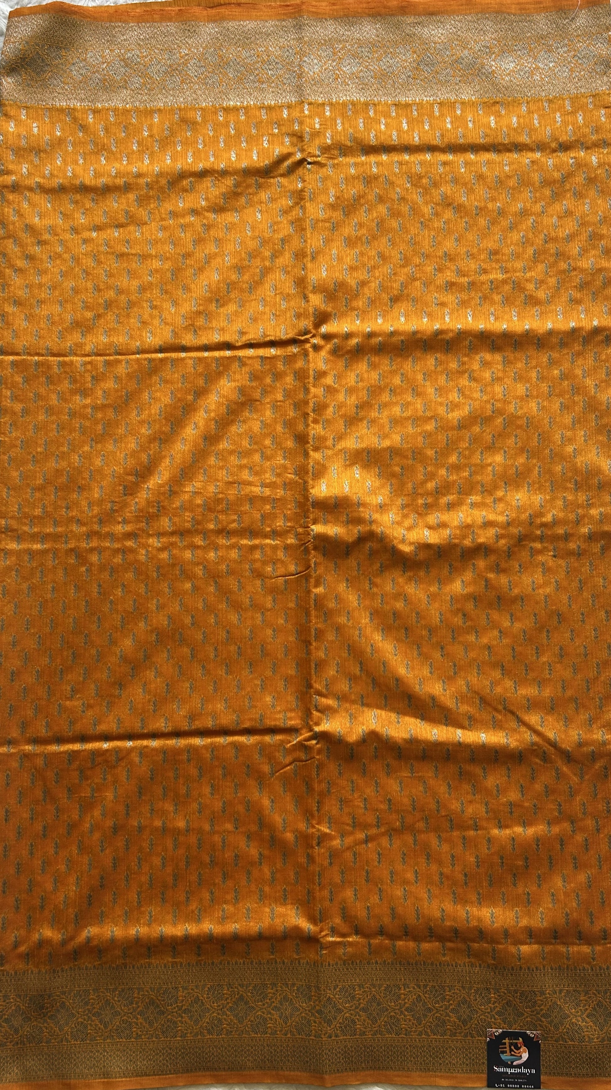 Semi Raw Silk Saree  Yellow Colored Elegantly paired with a Silver Zari Border. - Sampradaya Designer Studio