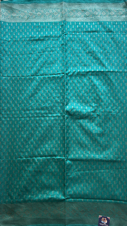 Semi Raw Silk Saree Teal Blue Colored Elegantly paired with a Silver Zari Border. - Sampradaya Designer Studio