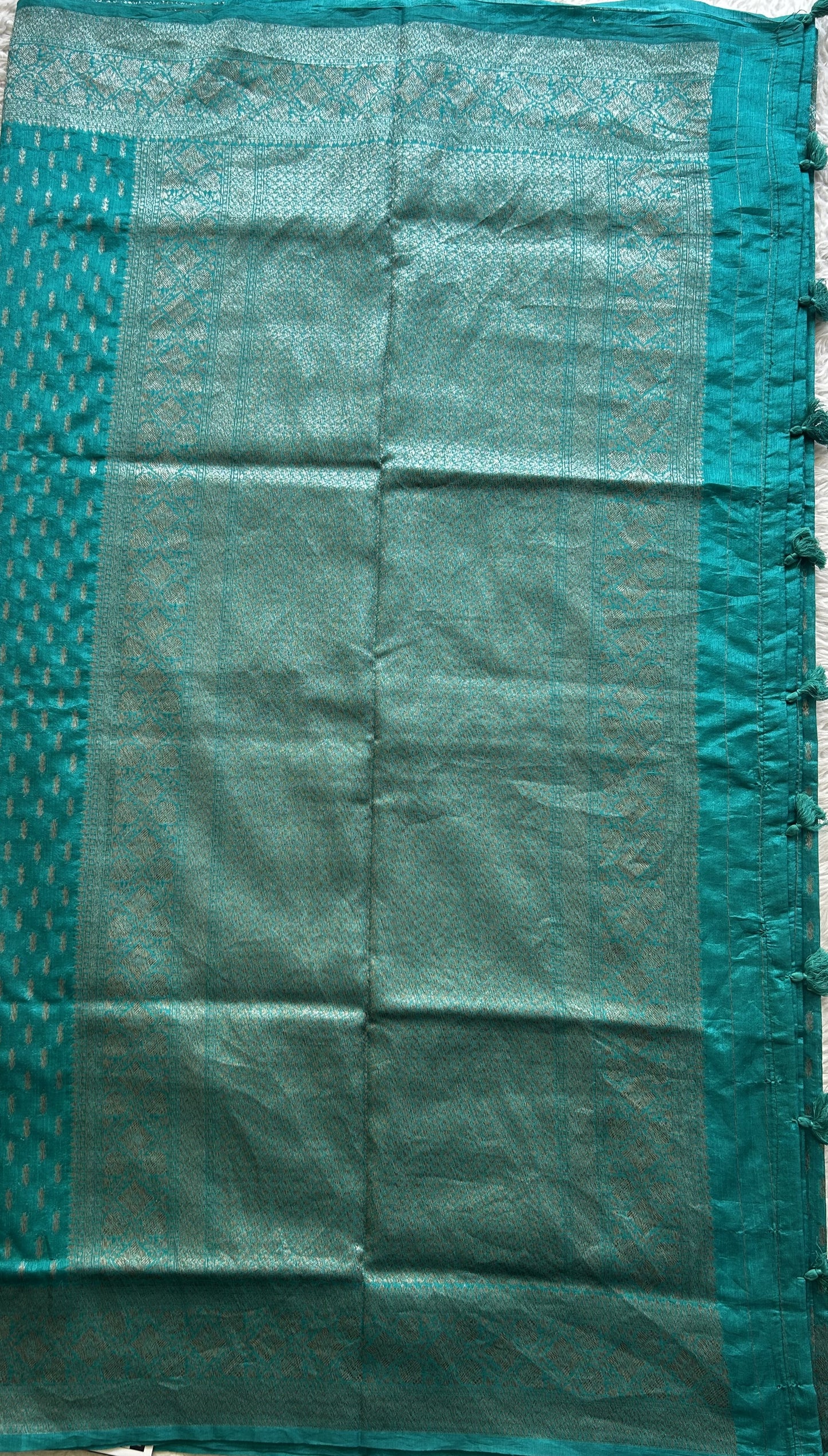 Semi Raw Silk Saree Teal Blue Colored Elegantly paired with a Silver Zari Border. - Sampradaya Designer Studio