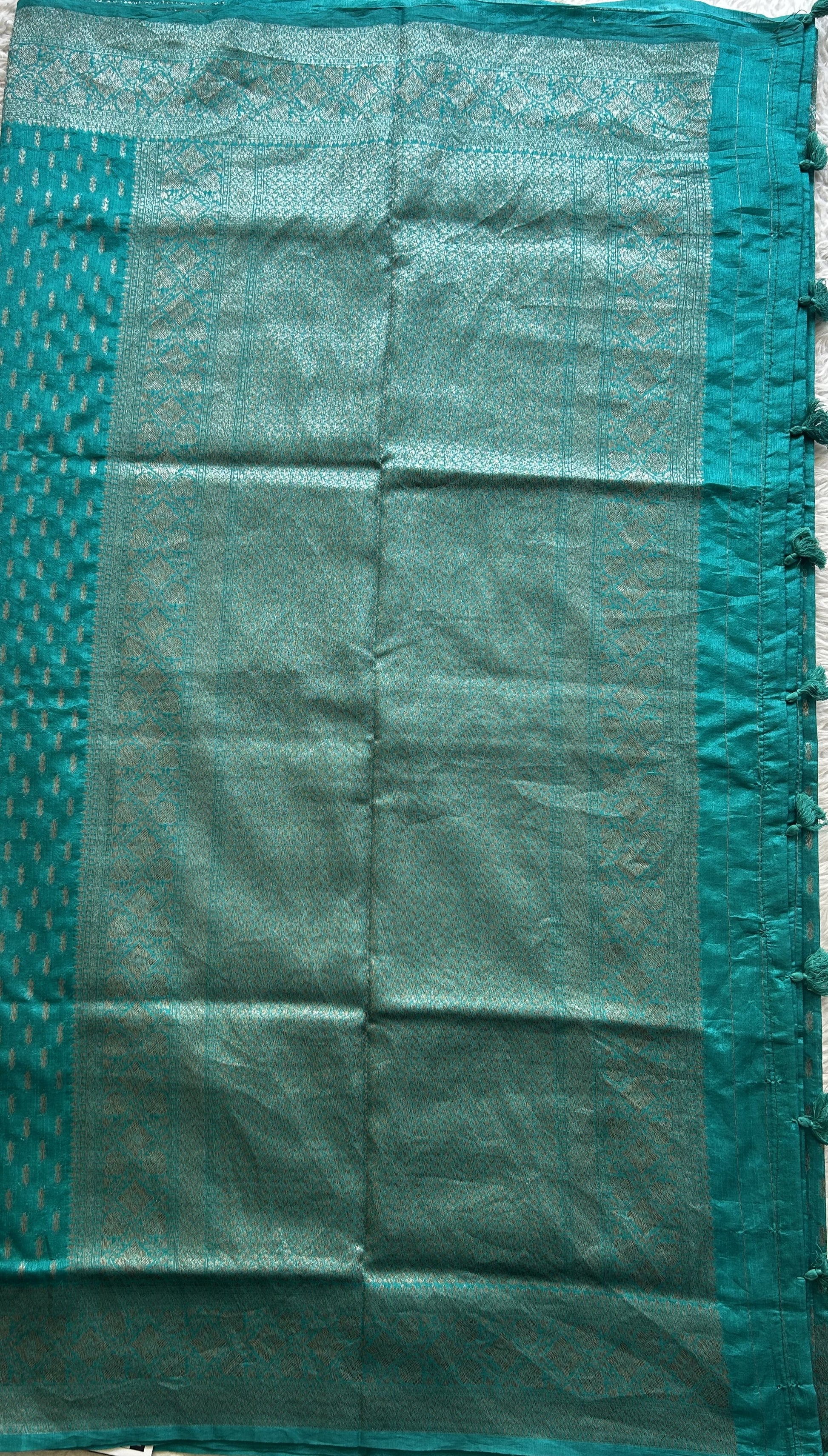 Semi Raw Silk Saree Teal Blue Colored Elegantly paired with a Silver Zari Border. - Sampradaya Designer Studio
