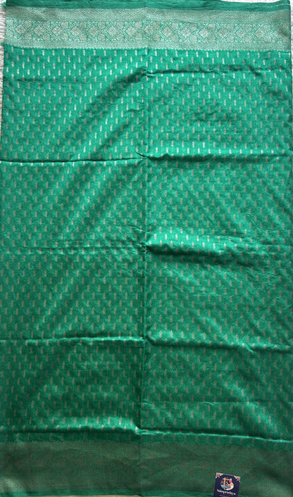 Semi Raw Silk Saree Rama Green Colored Elegantly paired with a Silver Zari Border. - Sampradaya Designer Studio