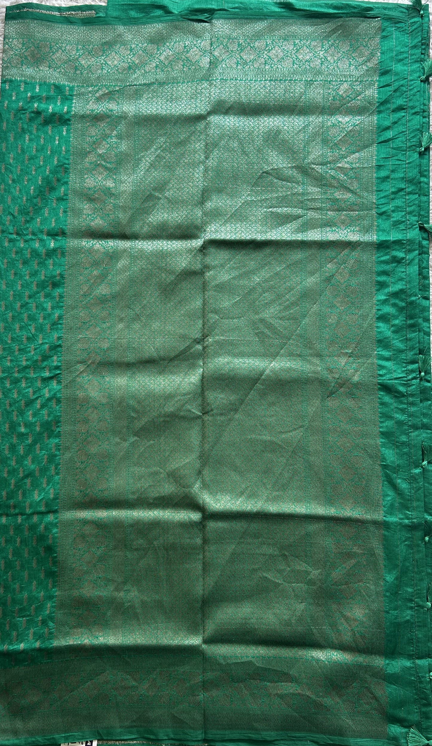 Semi Raw Silk Saree Rama Green Colored Elegantly paired with a Silver Zari Border. - Sampradaya Designer Studio