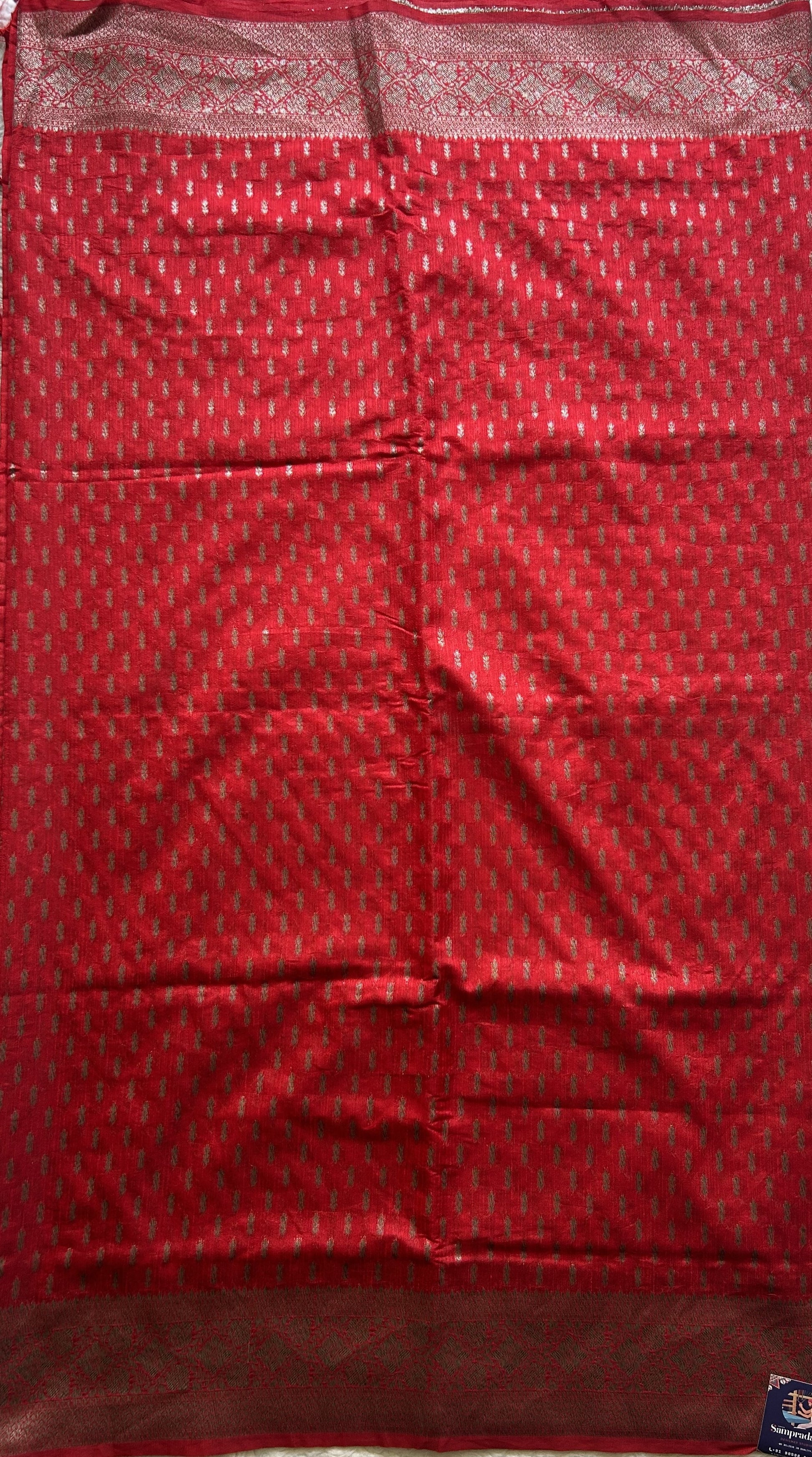 Semi Raw Silk Saree Red Colored Elegantly paired with a Silver Zari Border. - Sampradaya Designer Studio