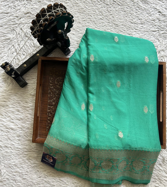 Semi Georgette Saree Rama Green Colored Elegantly Paired with Silver Zari Border. - Sampradaya Designer Studio