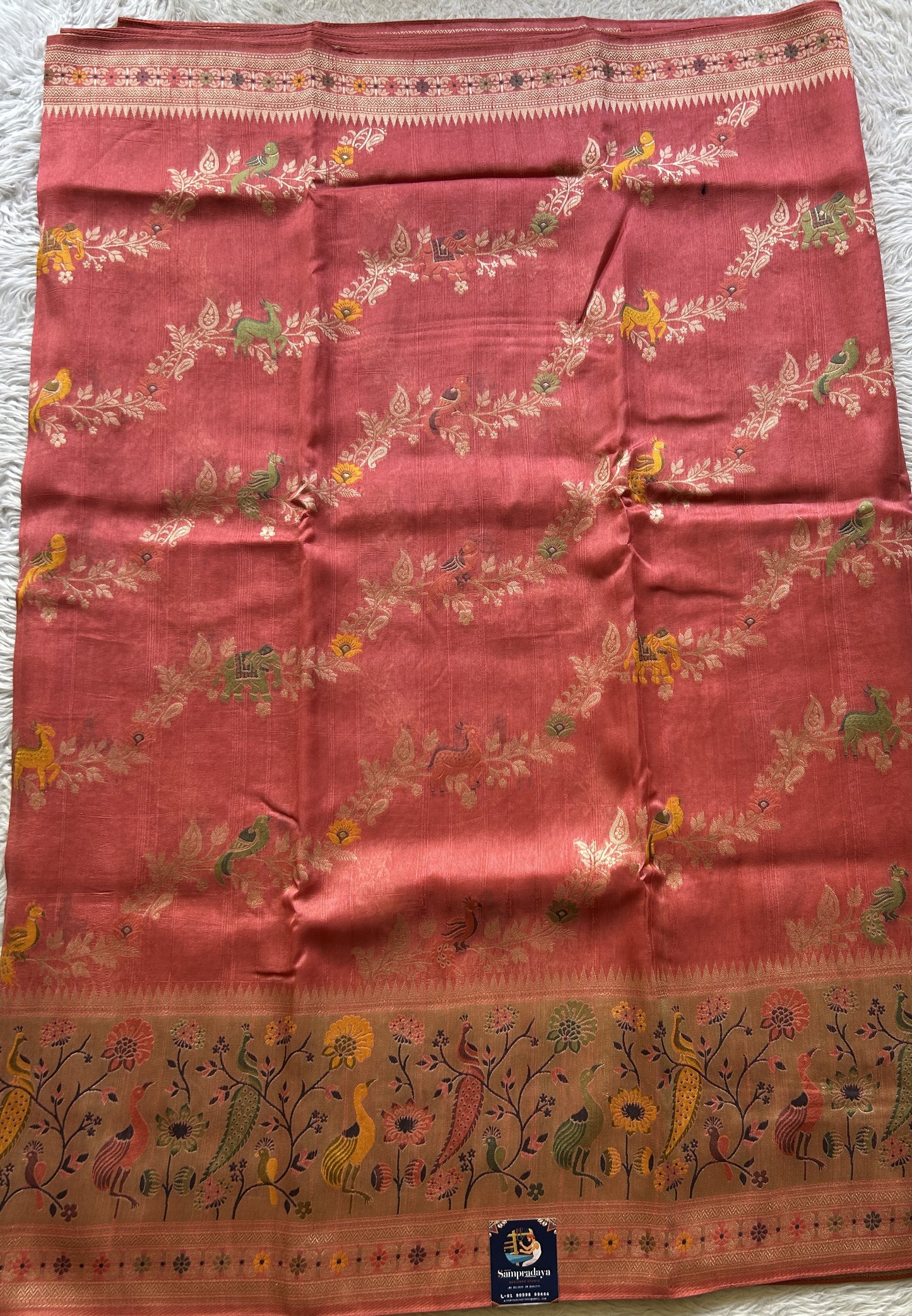 Banarasi Tussar Georgette Allover Saree Peach Colored Paired with a Zari Border. - Sampradaya Designer Studio