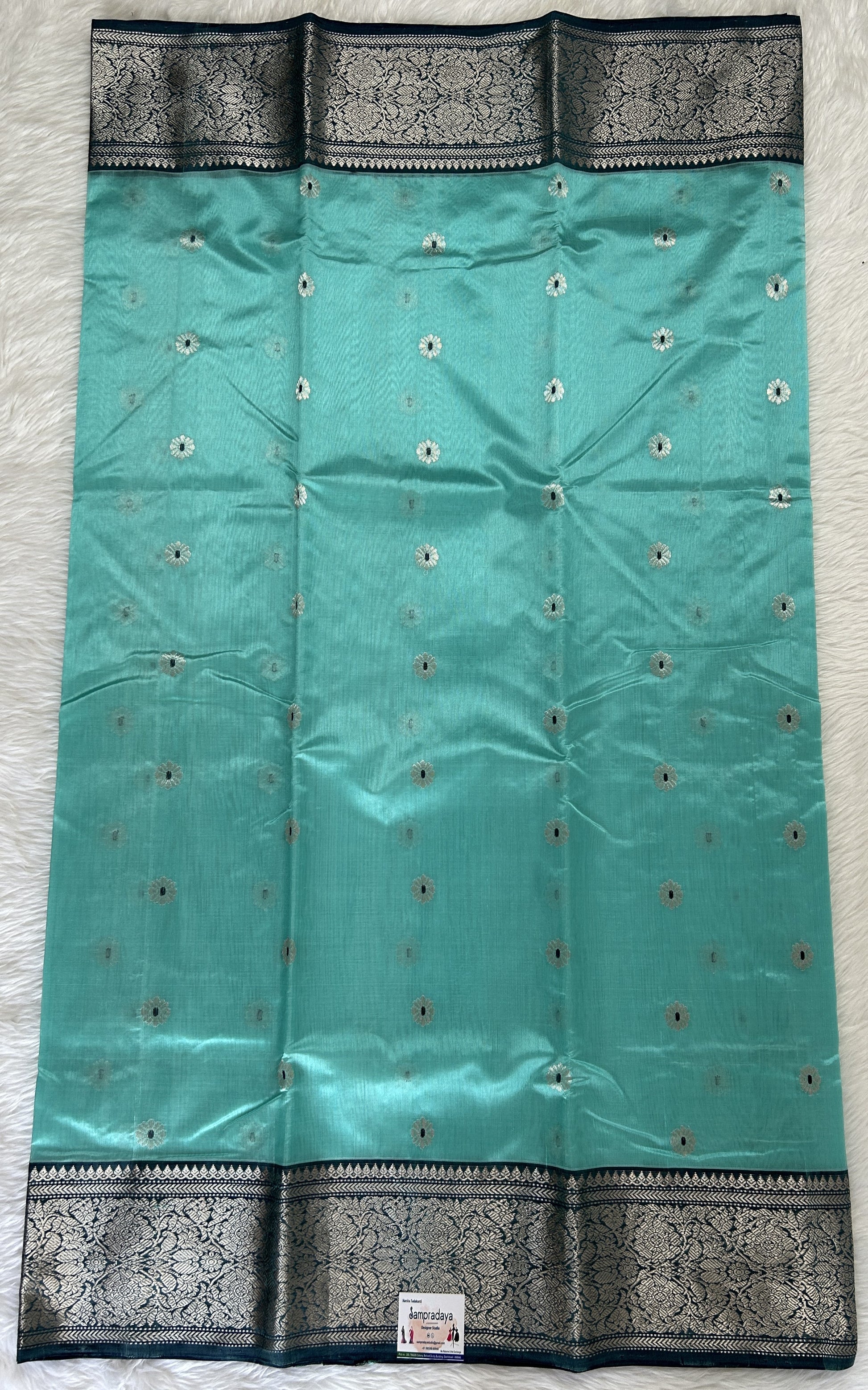 Chanderi Pattu Saree Sea Blue colored saree complemented with a Dark Grey Kanchi Border - Sampradaya Designer Studio