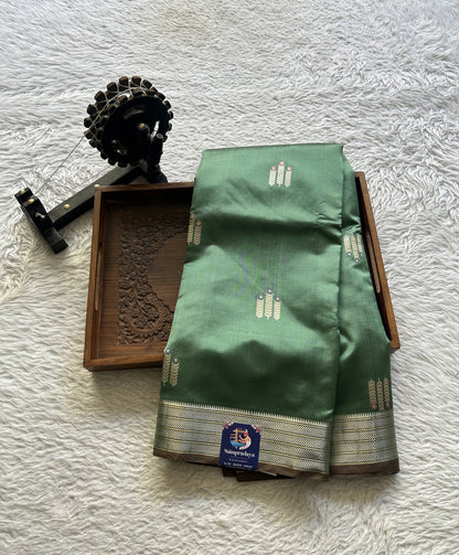 Banarasi Katan Silk Saree Sea Green Colored Elegantly Paired with a Zari border. - Sampradaya Designer Studio
