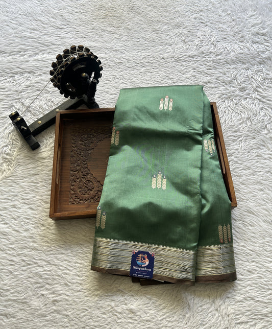 Banarasi Katan Silk Saree Sea Green Colored Elegantly Paired with a Zari border. - Sampradaya Designer Studio