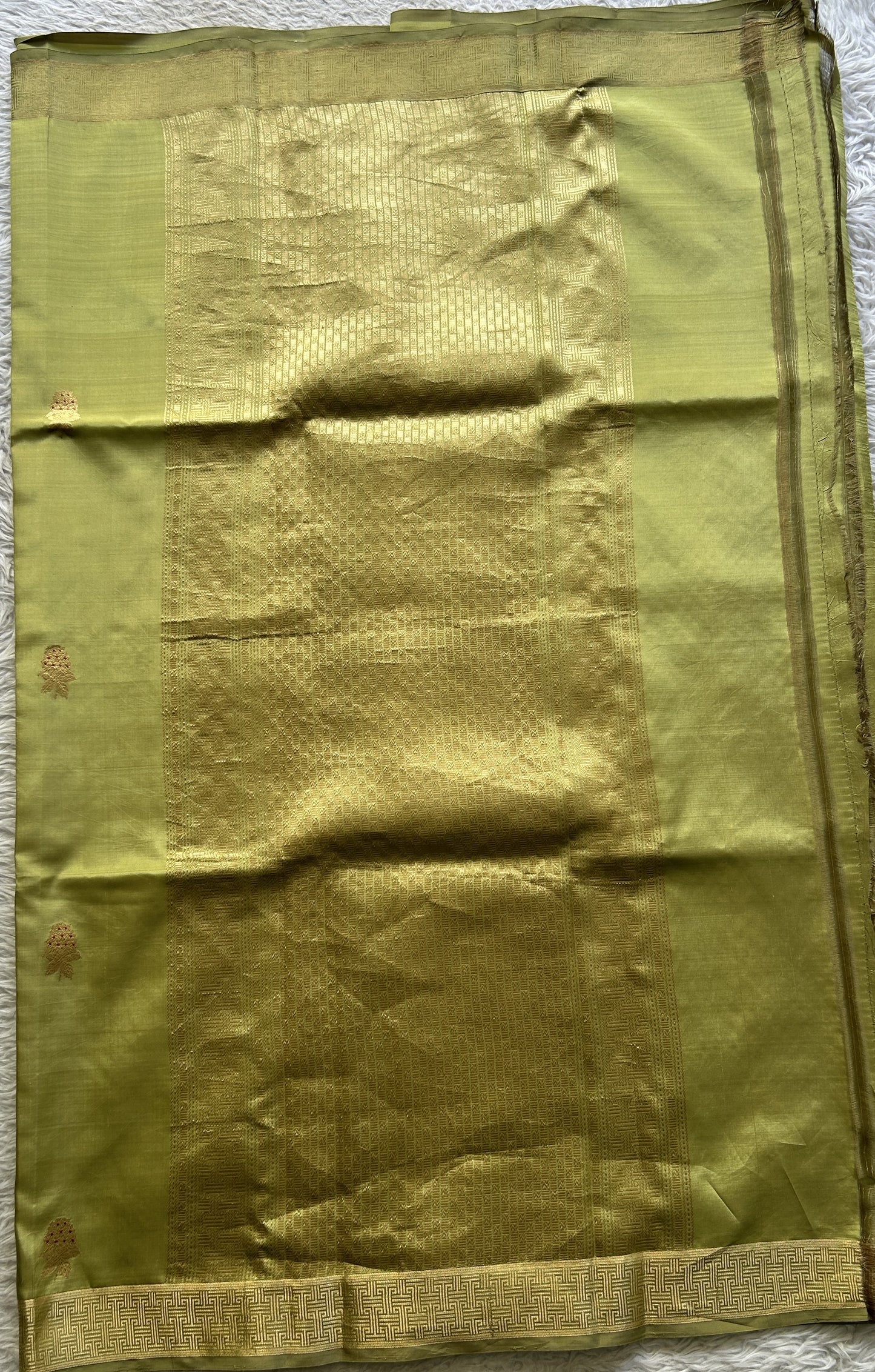 Banarasi Katan Silk Saree Light Olive Green Colored Elegantly Paired with a Zari border. - Sampradaya Designer Studio