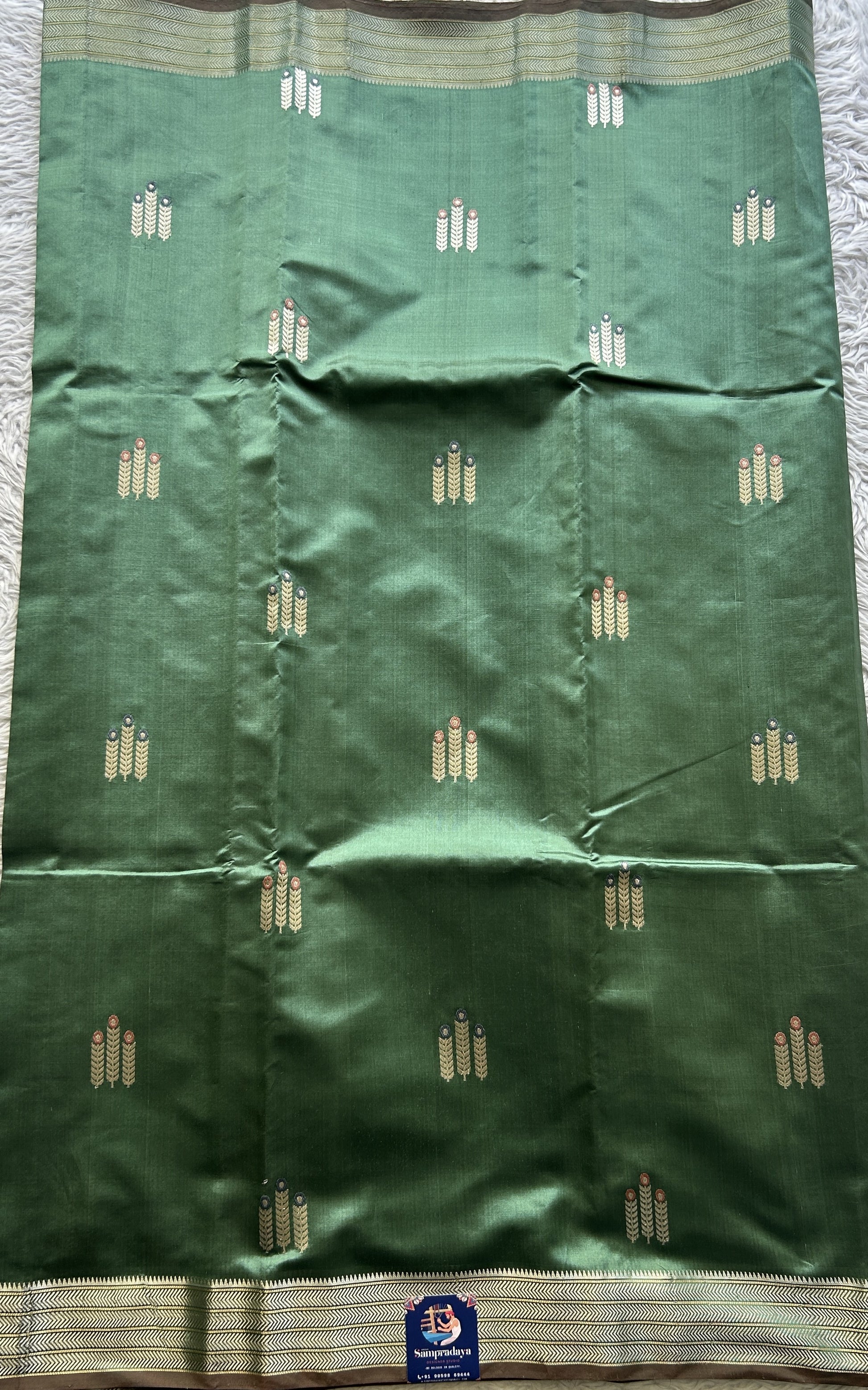 Banarasi Katan Silk Saree Sea Green Colored Elegantly Paired with a Zari border. - Sampradaya Designer Studio
