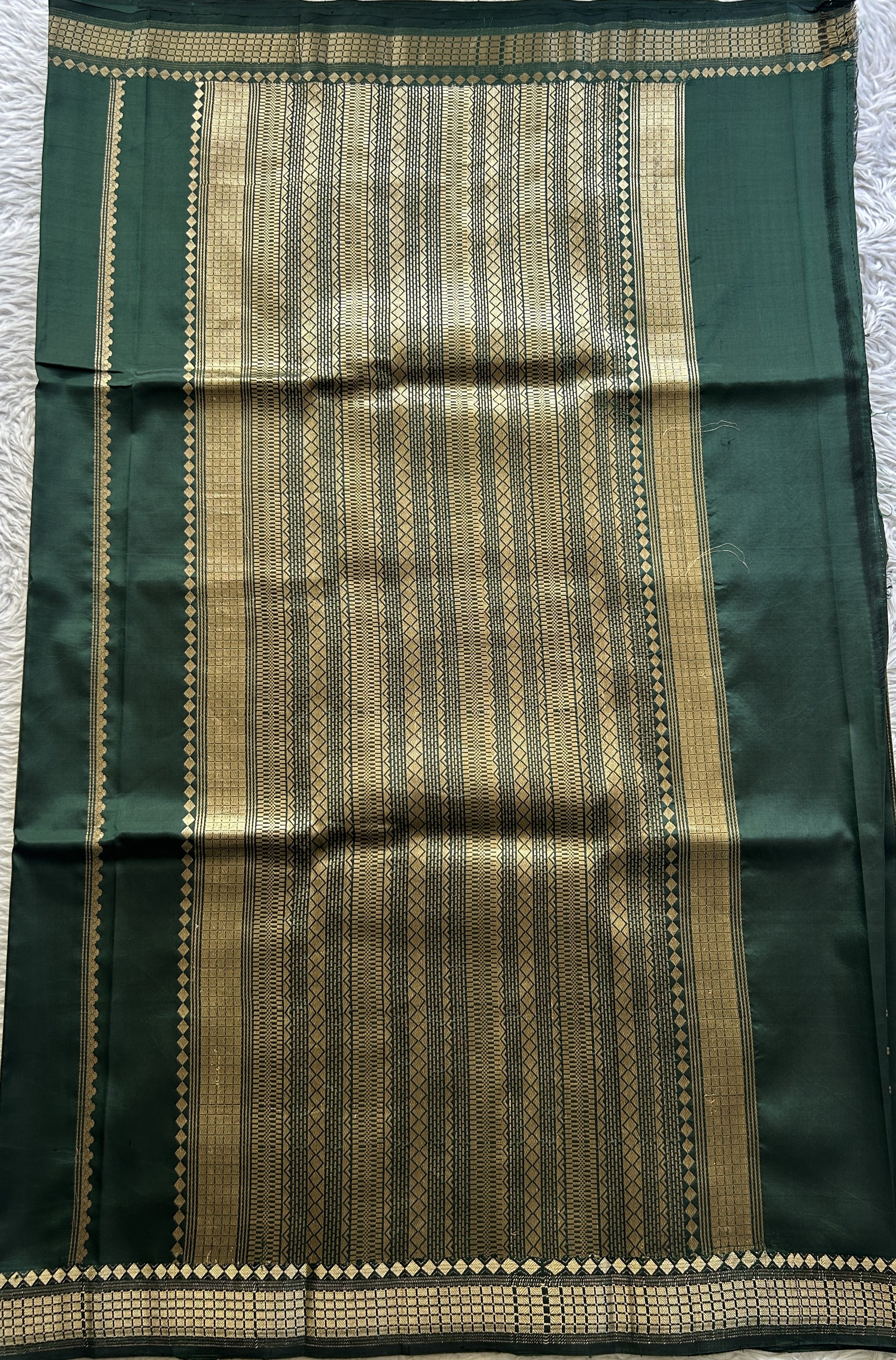 Banarasi Katan Silk Saree Dark Green Colored Elegantly Paired with a Zari border. - Sampradaya Designer Studio