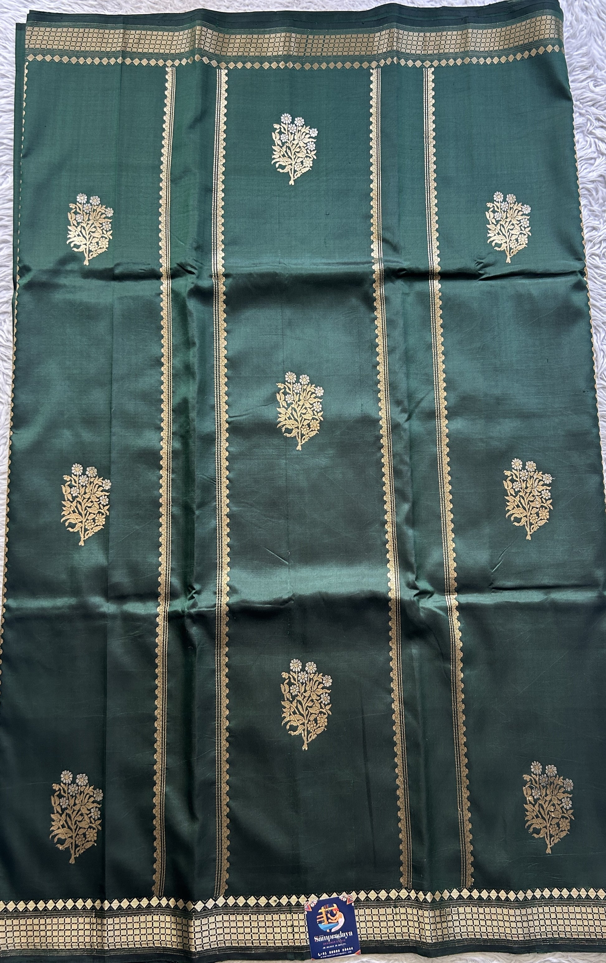 Banarasi Katan Silk Saree Dark Green Colored Elegantly Paired with a Zari border. - Sampradaya Designer Studio