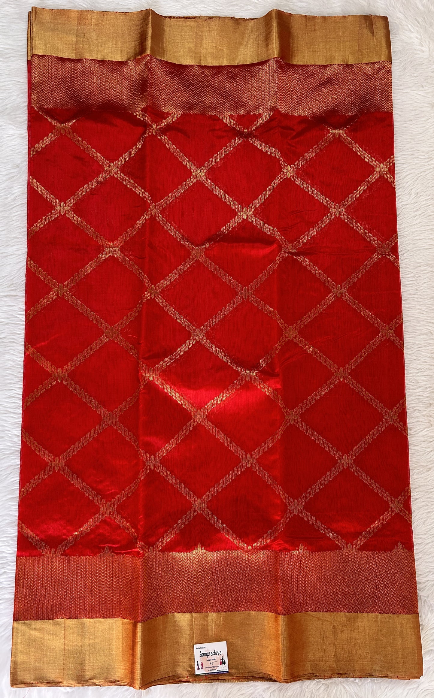 Chanderi Pattu Saree Red colored saree complemented with a Gold Zari Border - Sampradaya Designer Studio