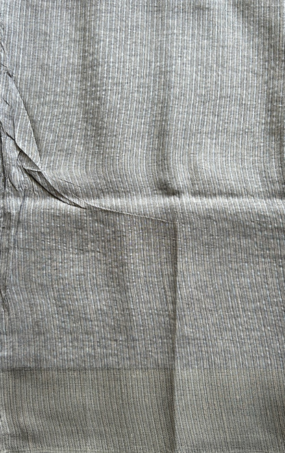 Semi Tussar Saree Gray Colored complemented with a Zari Border. - Sampradaya Designer Studio