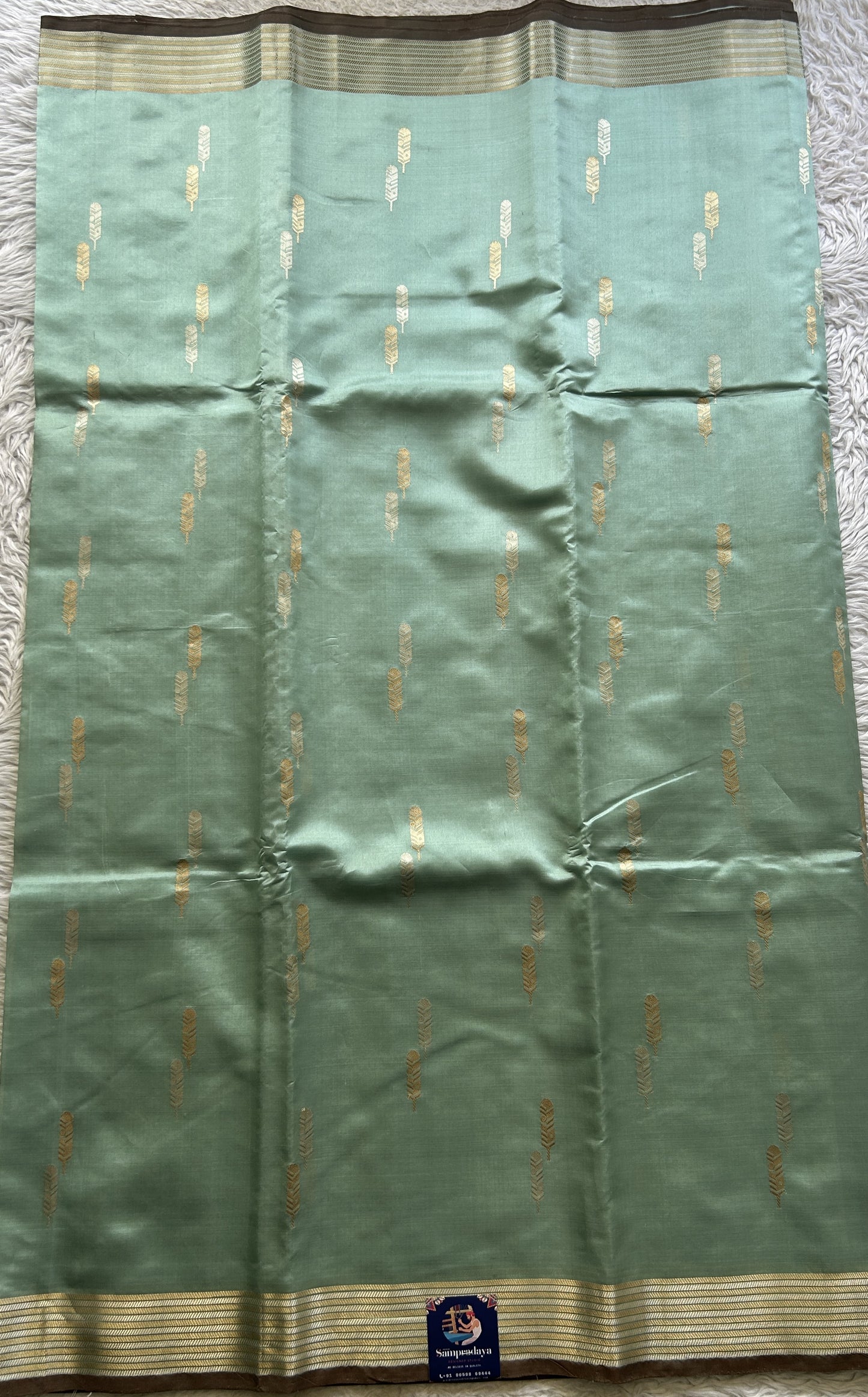 Banarasi Katan Silk Saree Sea Blue Colored Elegantly Paired with a Zari border. - Sampradaya Designer Studio