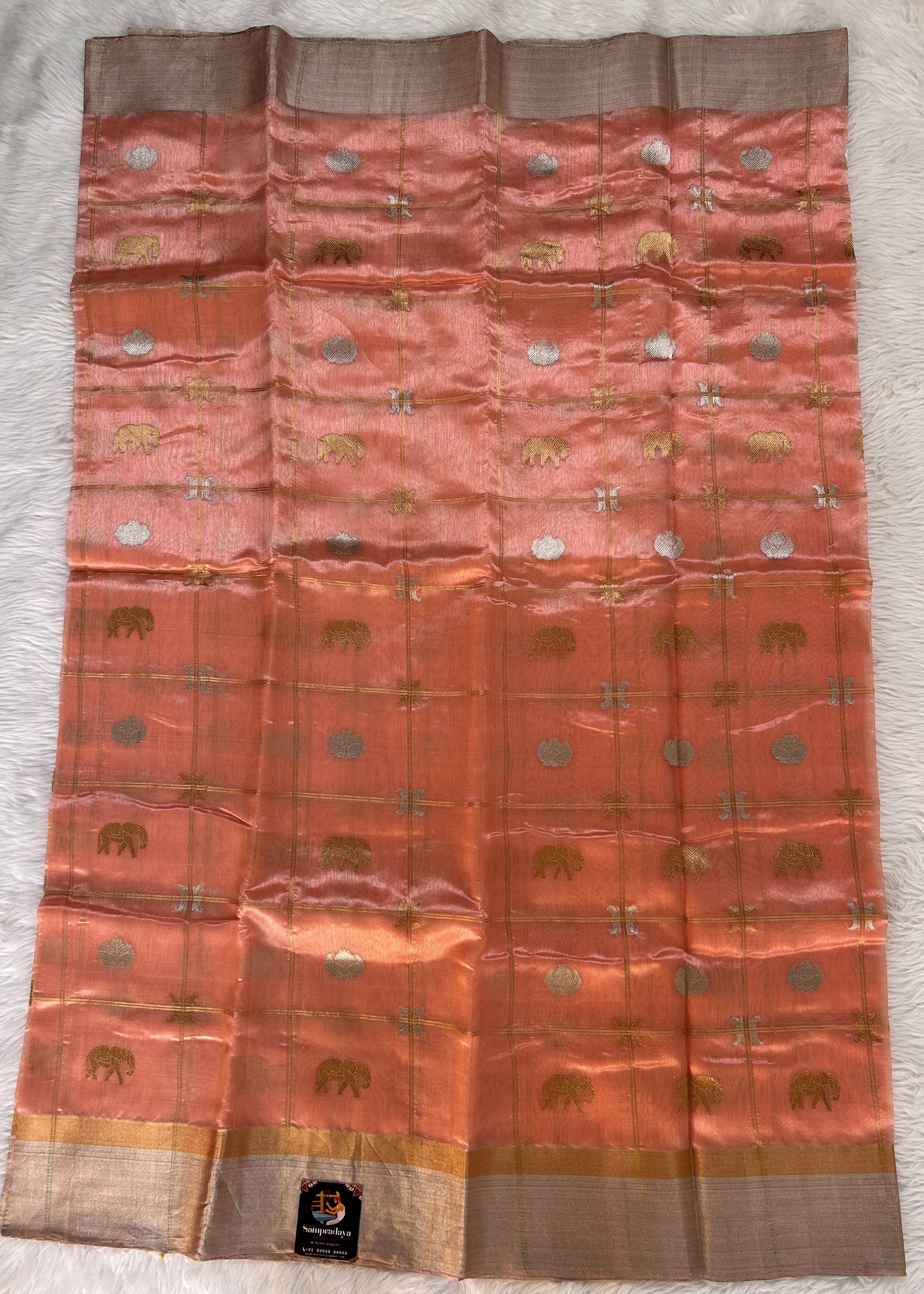 Chanderi Pattu Saree Peach colored saree complemented with a Silver Zari Border - Sampradaya Designer Studio