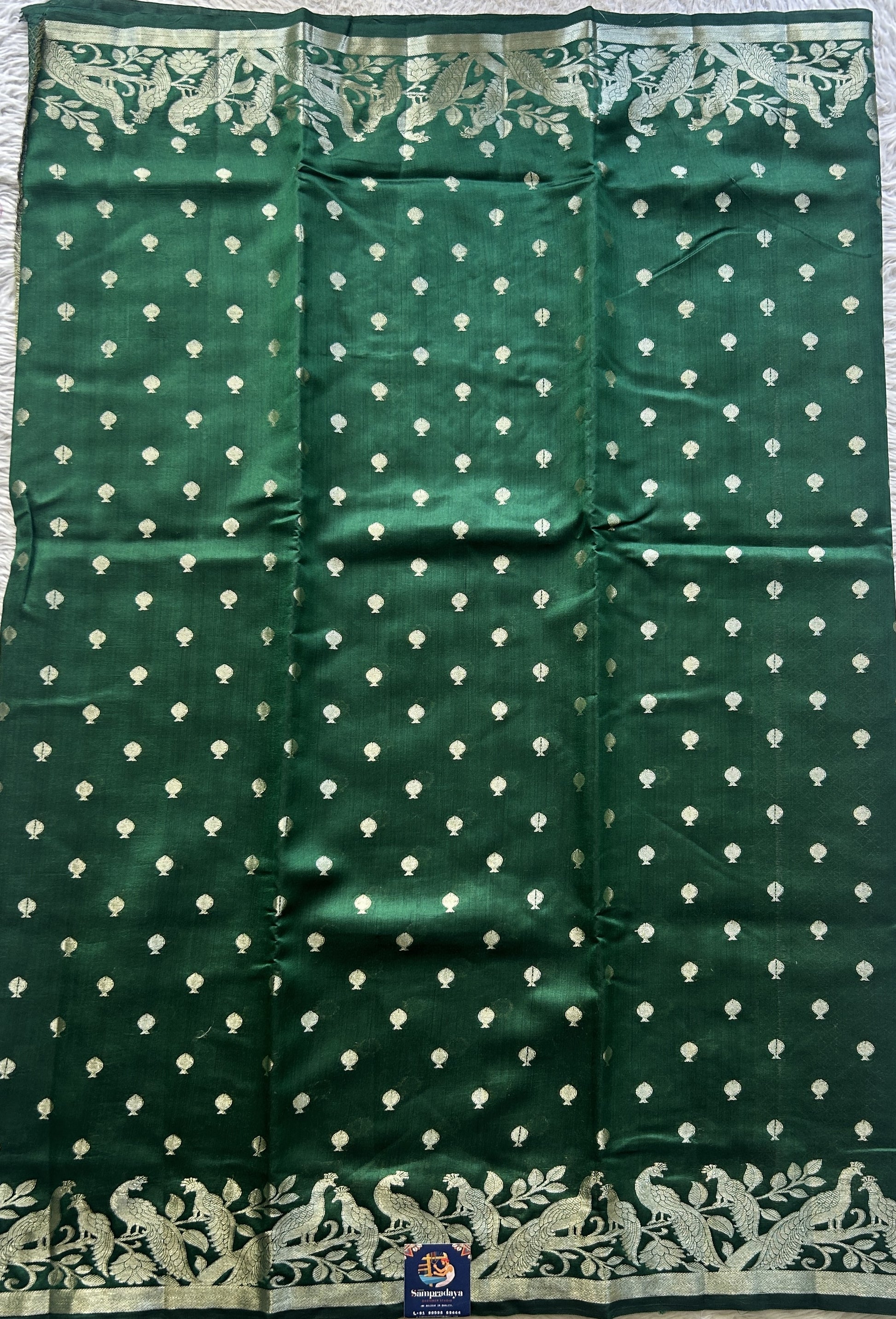 Chiniya Silk Saree Dark Green Colored Elegantly Paired with a Jal Border. - Sampradaya Designer Studio