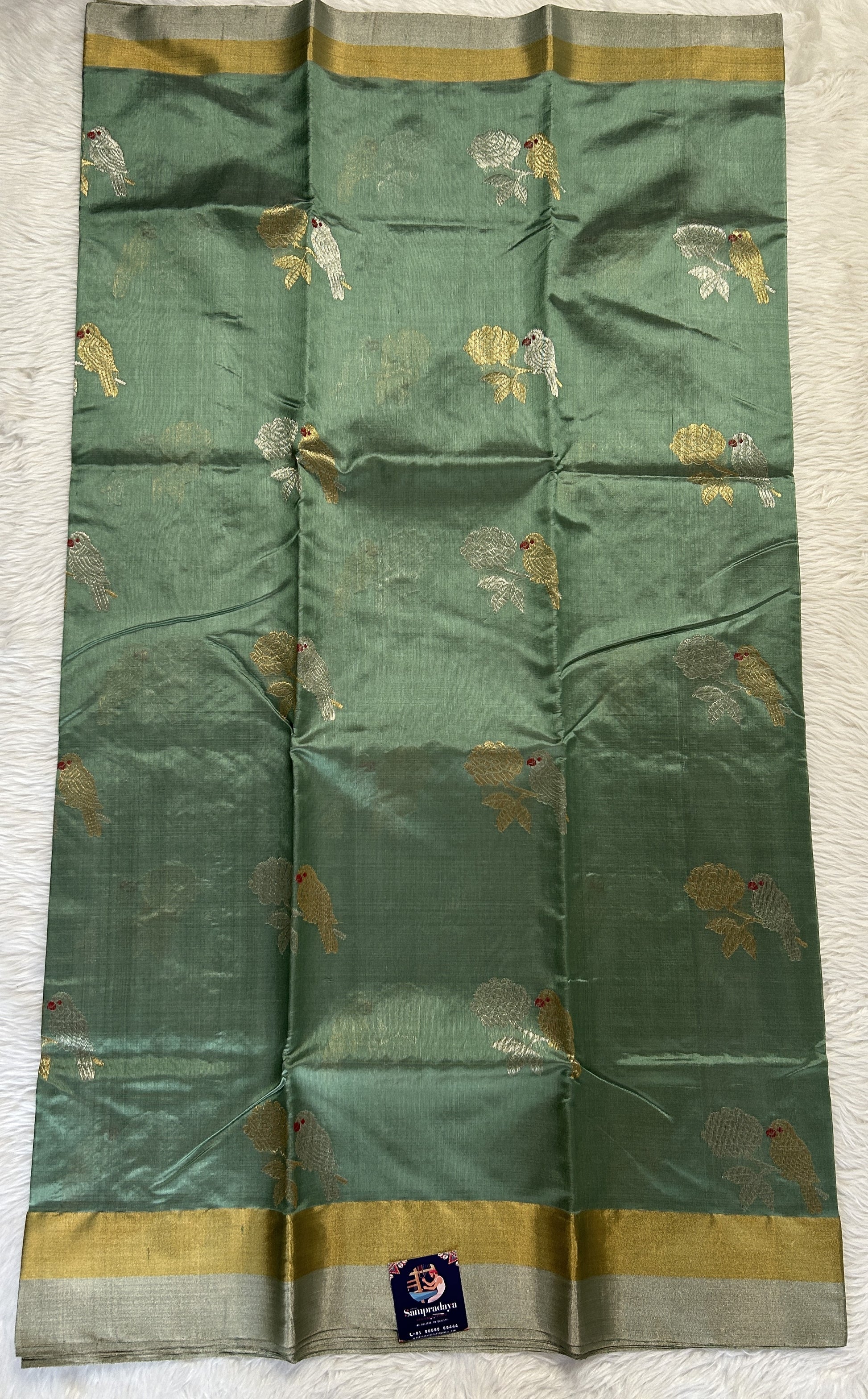 Chanderi Pattu Saree Cool Green colored saree complemented with a Gold &Silver Zari border - Sampradaya Designer Studio