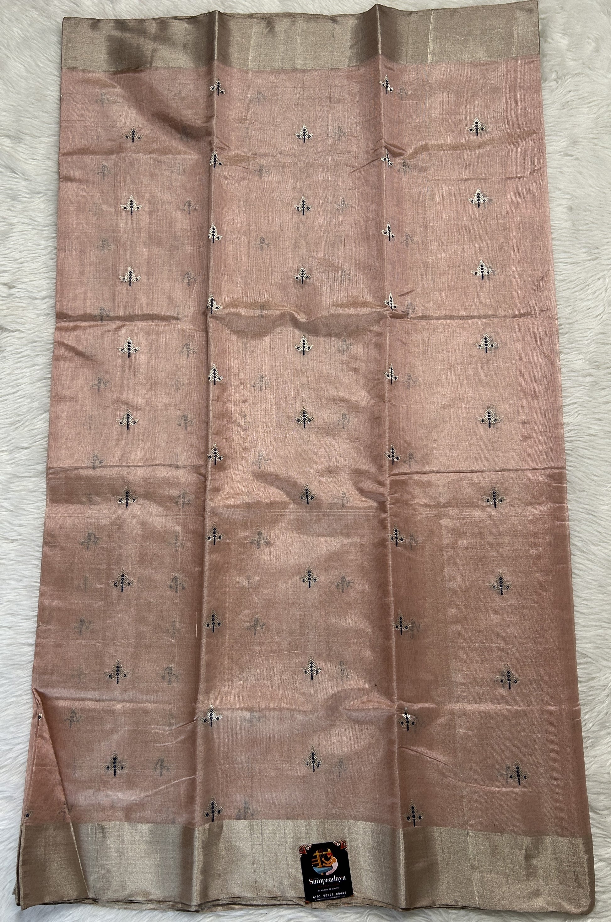 Chanderi Pattu Saree Light Peach colored saree complemented with a Silver Zari border - Sampradaya Designer Studio