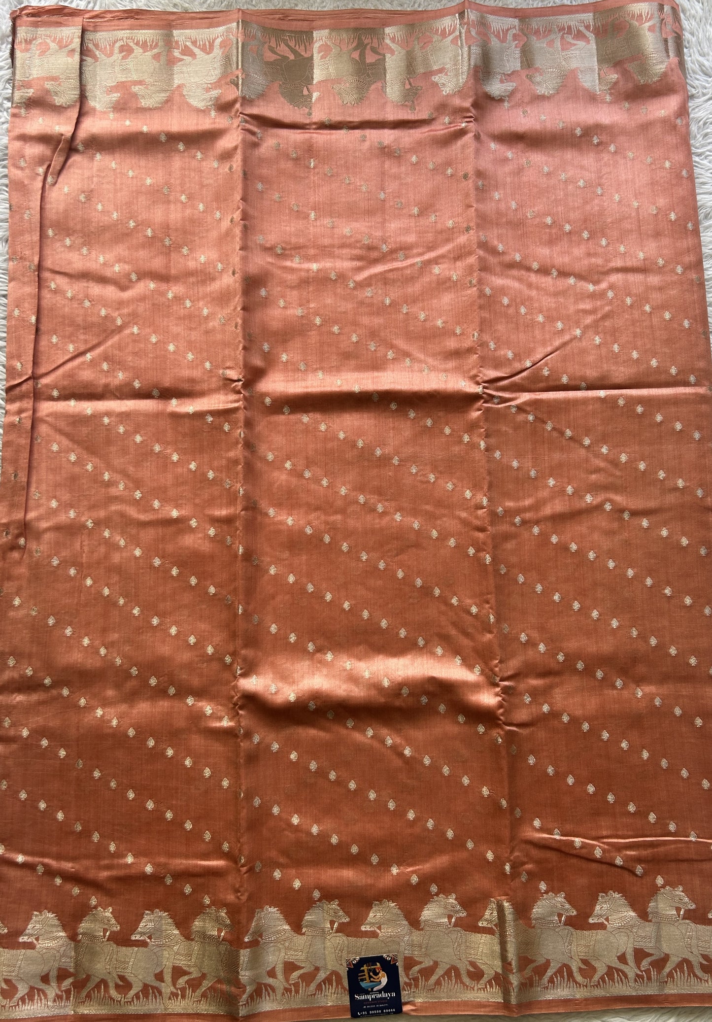 Chiniya Silk Saree Peach Colored Elegantly Paired with a Zari Border. - Sampradaya Designer Studio