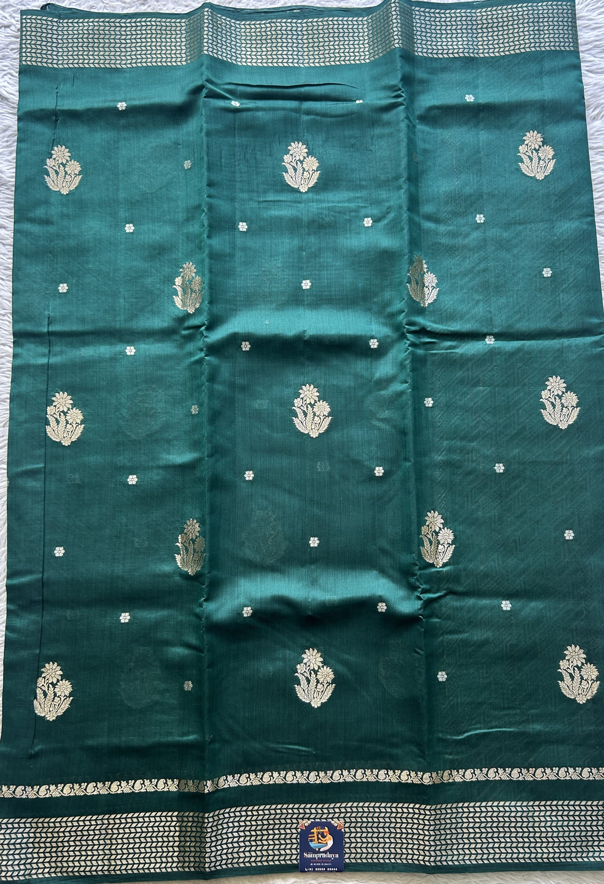 Chiniya Silk Saree Bottle Green Colored Elegantly Paired with a Zari Border. - Sampradaya Designer Studio