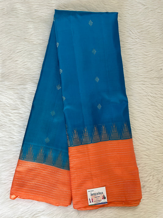 Gadwal Pattu Saree Regal Blue colored saree complemented with a Pastel Orange Plain Border - Sampradaya Designer Studio