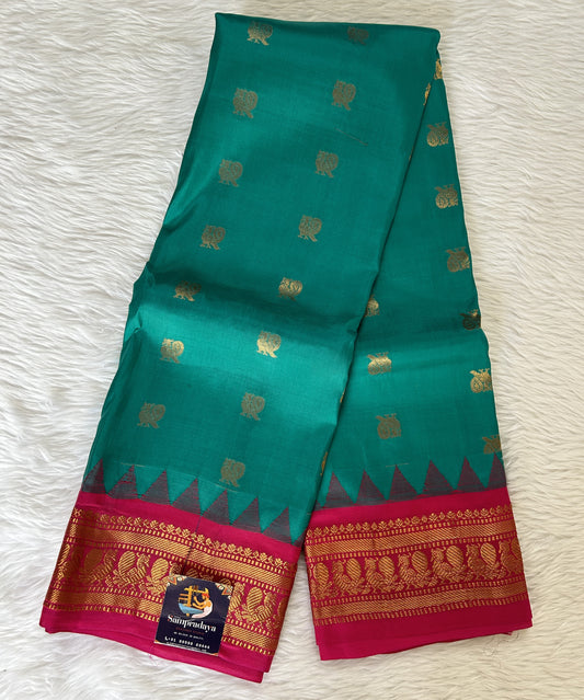 Gadwal Pattu Saree Emerald Green colored saree complemented with a Pink Kanchi Border - Sampradaya Designer Studio