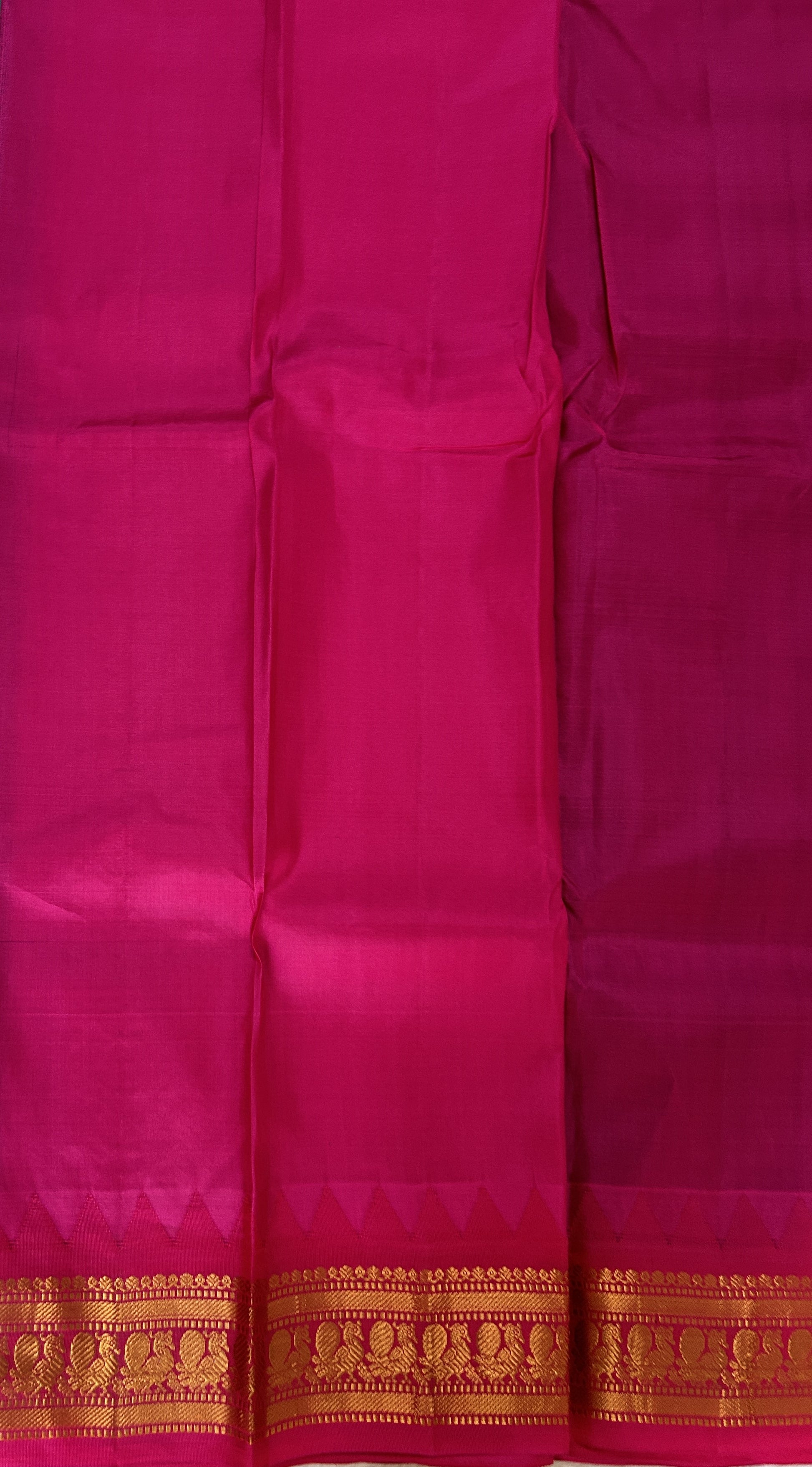 Gadwal Pattu Saree Emerald Green colored saree complemented with a Pink Kanchi Border - Sampradaya Designer Studio