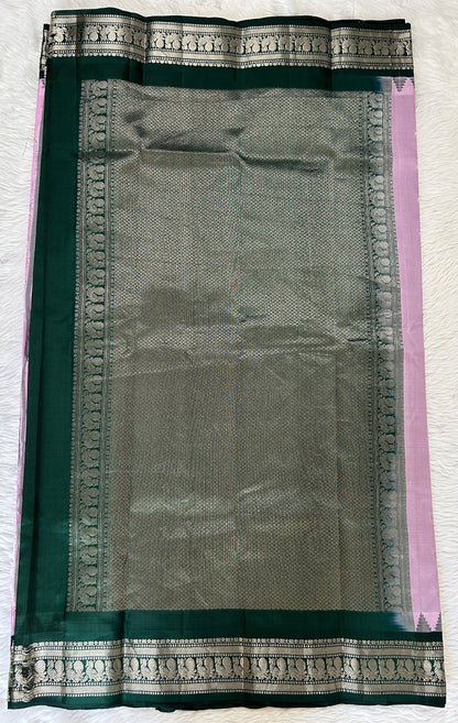 Gadwal Pattu Saree Baby Pink colored saree complemented with a Bottle green Kanchi Border - Sampradaya Designer Studio