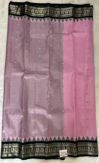 Gadwal Pattu Saree Baby Pink colored saree complemented with a Bottle green Kanchi Border - Sampradaya Designer Studio