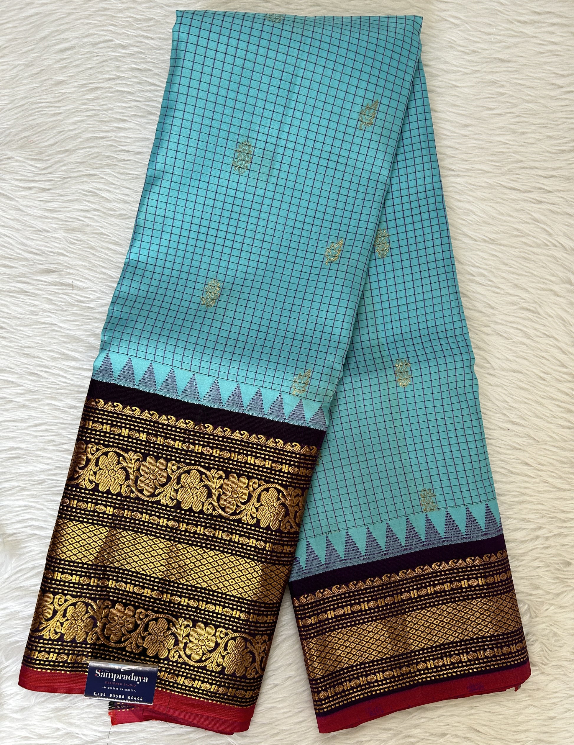 Gadwal Pattu Saree Fountain Blue colored saree complemented with a Dark Violet Kanchi Border - Sampradaya Designer Studio