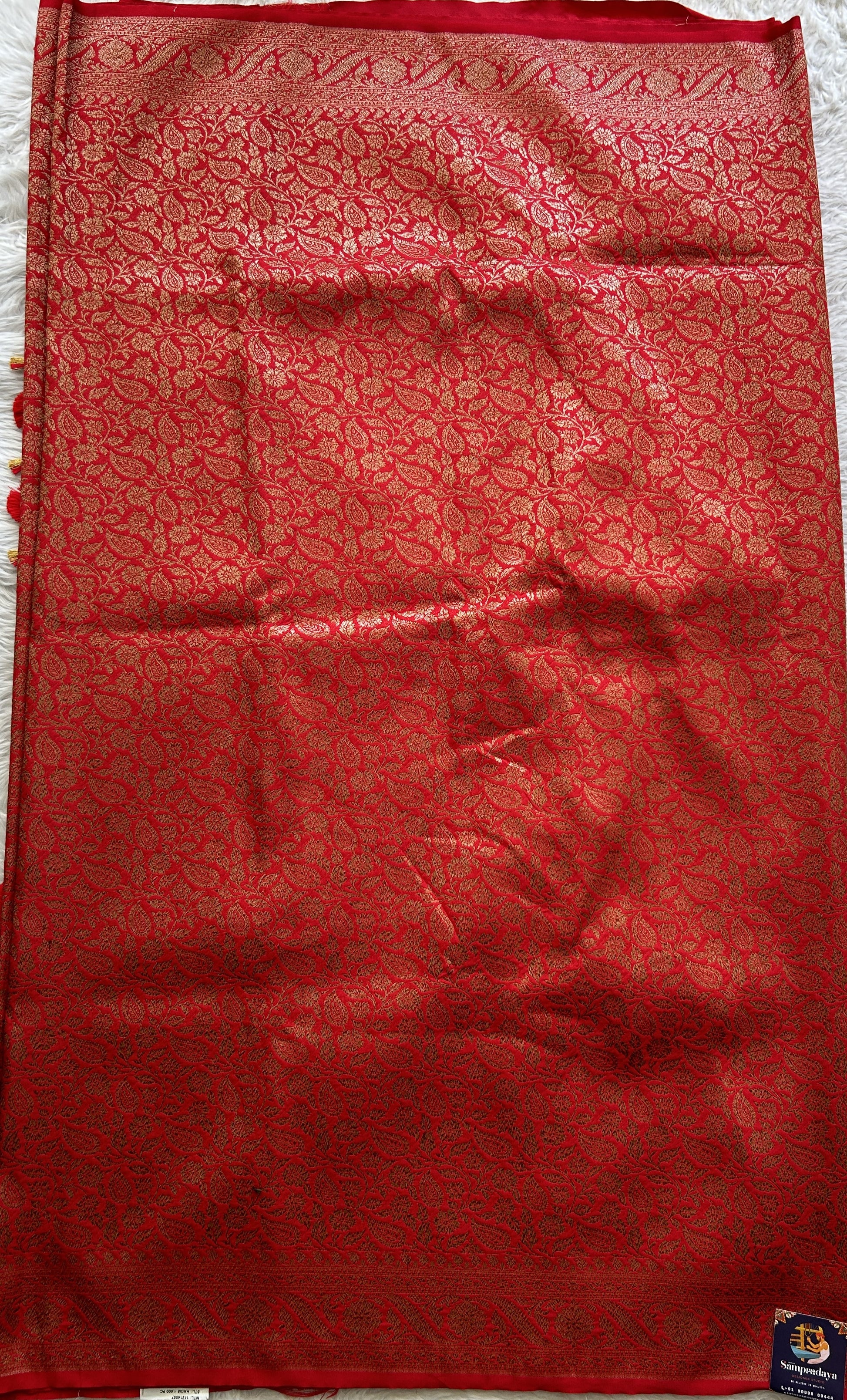 Banarasi Semi Katan Saree Red Colored Complemented with a Zari Border. - Sampradaya Designer Studio