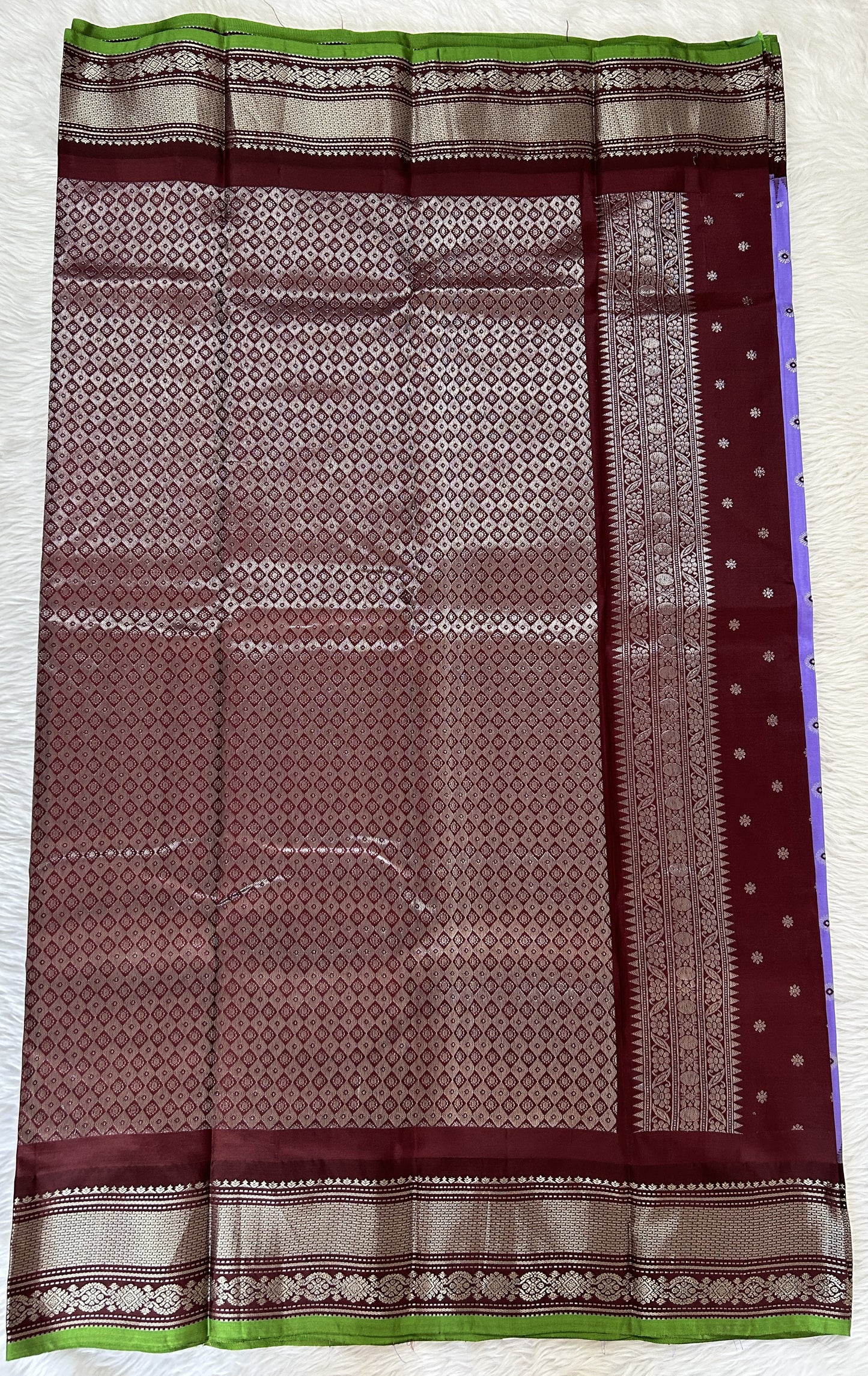 Gadwal Pattu Saree Lavender colored saree complemented with a Brown Kanchi Border - Sampradaya Designer Studio