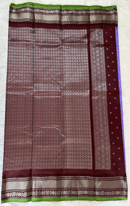 Gadwal Pattu Saree Lavender colored saree complemented with a Brown Kanchi Border - Sampradaya Designer Studio